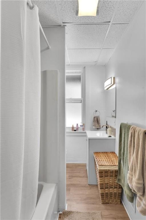 2832 Clermont Ave, Brentwood, PA 15227 - bathroom with wood finished floors, vanity, a drop ceiling, and shower / bathtub combination with curtain