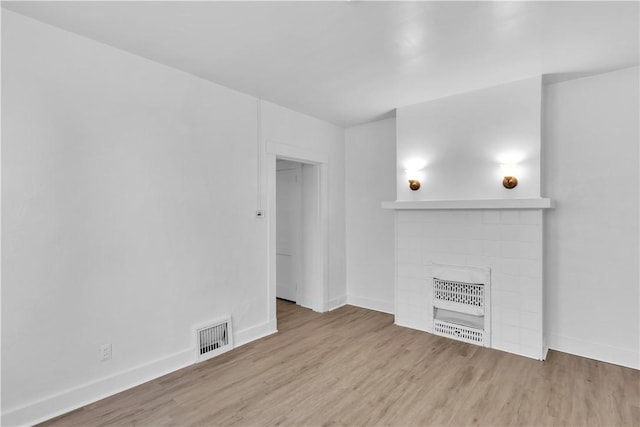 2832 Clermont Ave, Brentwood, PA 15227 - unfurnished living room with wood finished floors, a fireplace, and baseboards