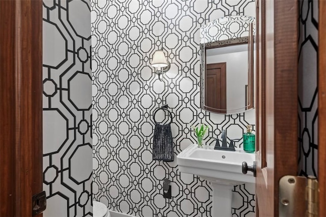 half bathroom featuring tile walls