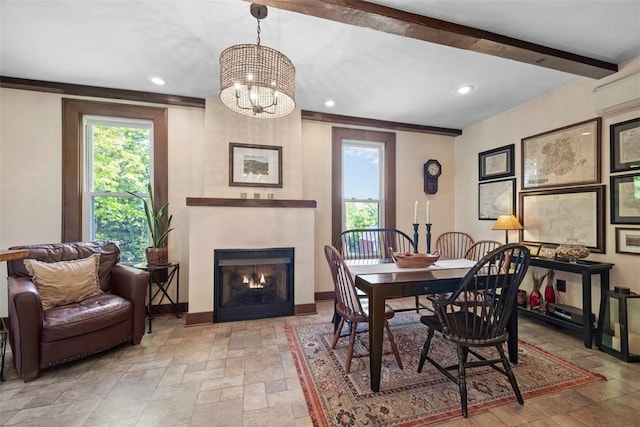 dining room with baseboards, stone tile floors, plenty of natural light, and recessed lighting