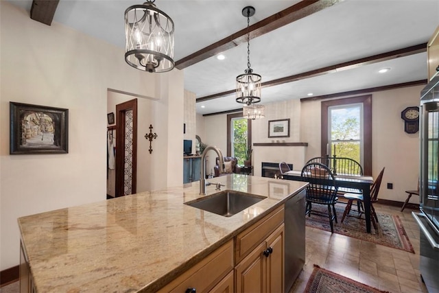 kitchen featuring a sink, beam ceiling, dishwasher, a chandelier, and plenty of natural light