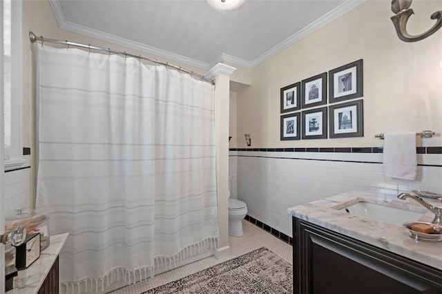 full bathroom with toilet, tile walls, vanity, crown molding, and tile patterned flooring