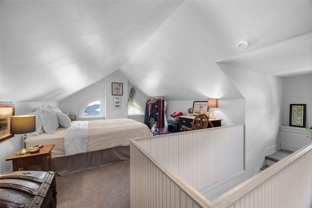 bedroom featuring carpet and lofted ceiling