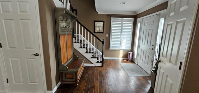 foyer entrance with baseboards, stairs, and dark wood-style floors