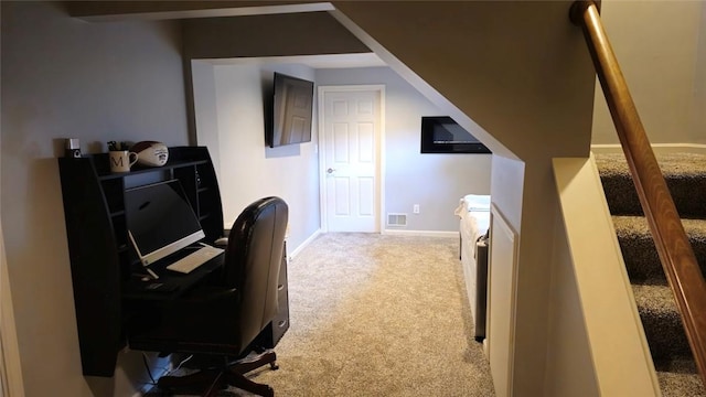 home office featuring carpet and baseboards