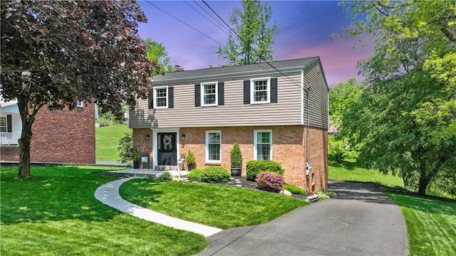 136 Bently Down Dr, Moon/Crescent Twp, PA 15108 - colonial inspired home featuring a lawn, brick siding, and a chimney