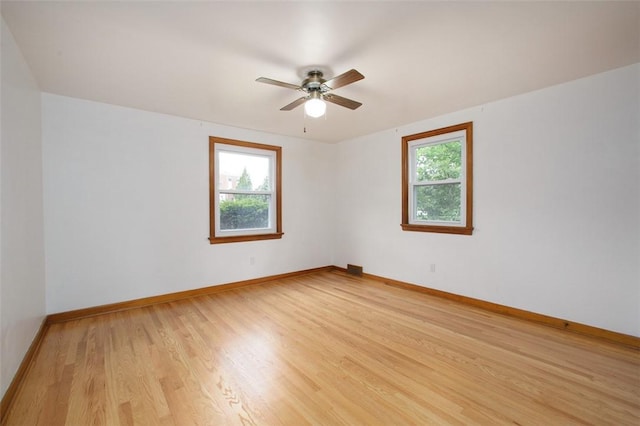 102 Olive Dr, Level Green, PA 15085 - spare room with plenty of natural light, light wood-style flooring, a ceiling fan, and baseboards