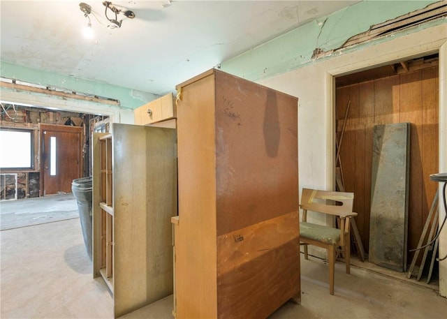 miscellaneous room featuring unfinished concrete flooring