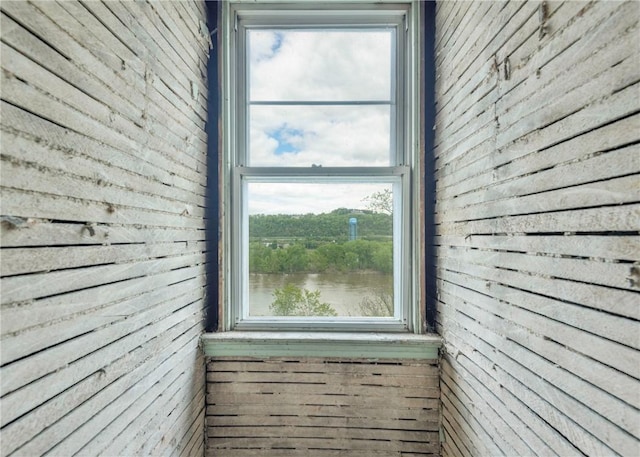 view of side of home featuring a water view