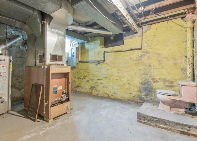 unfinished basement with heating unit and gas water heater
