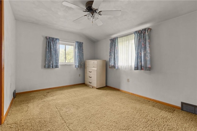 677 Olive St, Mccandless, PA 15237 - unfurnished bedroom featuring carpet floors, vaulted ceiling, baseboards, and a ceiling fan