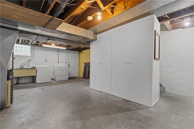 677 Olive St, Mccandless, PA 15237 - below grade area featuring washing machine and dryer, a sink, and stairs