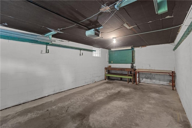 677 Olive St, Mccandless, PA 15237 - garage with a garage door opener and concrete block wall