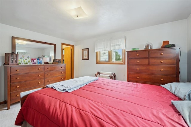bedroom with light colored carpet