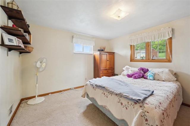 carpeted bedroom with baseboards