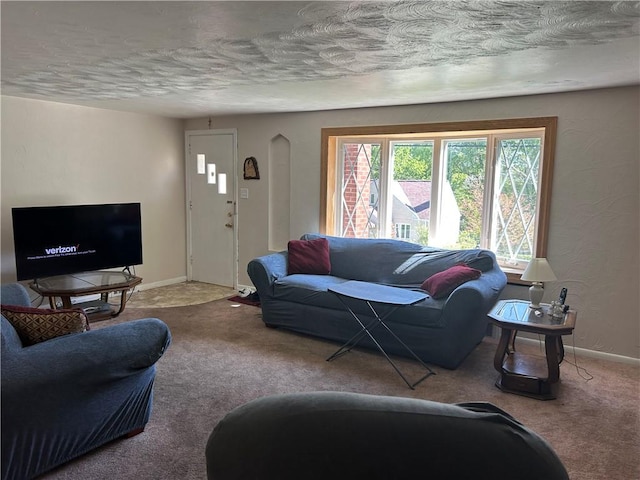 316 Franklin Dr, Peters Twp, PA 15241 - carpeted living room featuring a textured ceiling, arched walkways, and baseboards