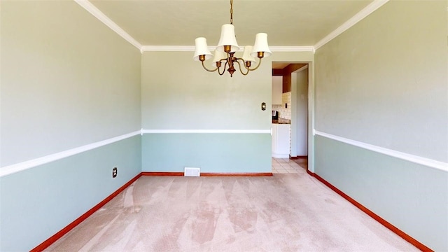 unfurnished room featuring a chandelier, crown molding, carpet, and baseboards