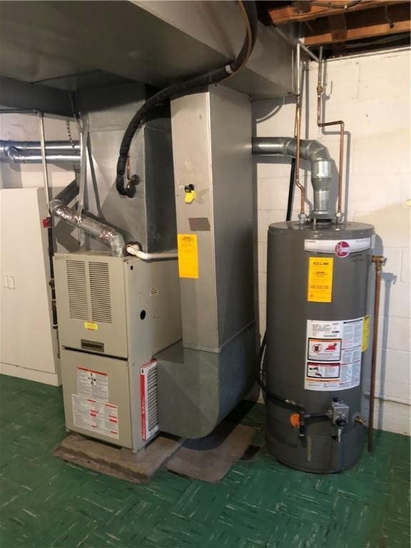 utility room with gas water heater and heating unit