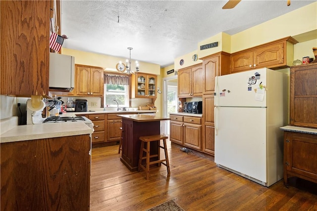 2915 Kane Rd, Hopewell Twp Bea, PA 15001 - kitchen with freestanding refrigerator, range, a textured ceiling, a chandelier, and dark wood finished floors
