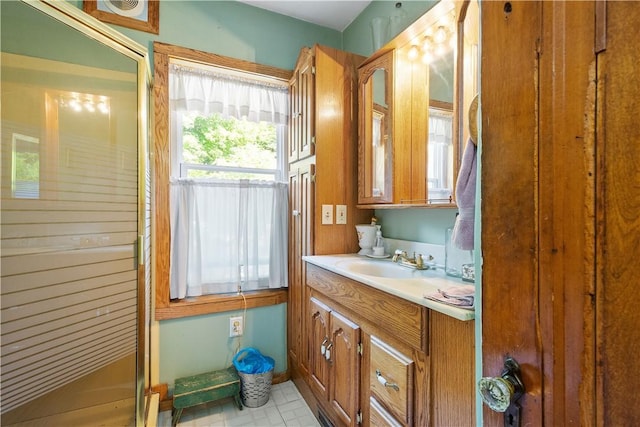bathroom with vanity and a stall shower