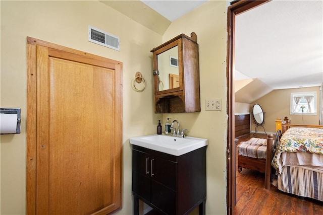 2915 Kane Rd, Hopewell Twp Bea, PA 15001 - bathroom featuring vanity, wood finished floors, ensuite bathroom, and vaulted ceiling