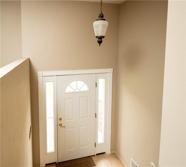 entryway featuring light tile patterned floors