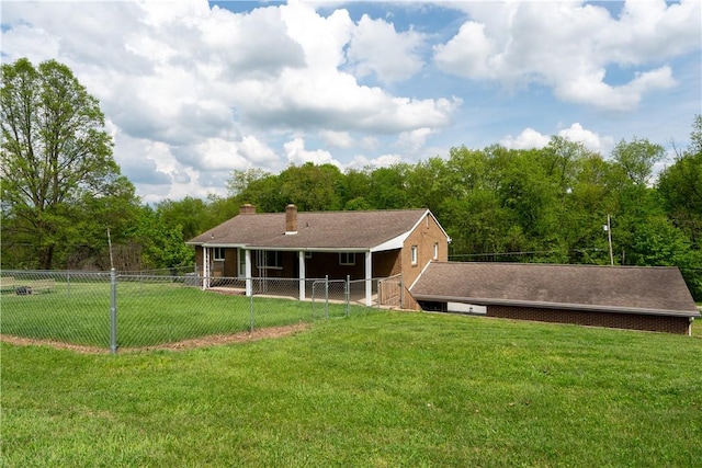 back of property with a chimney