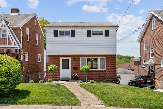 2228 Walton Ave, Overbrook, PA 15210 - colonial inspired home with a front lawn and brick siding