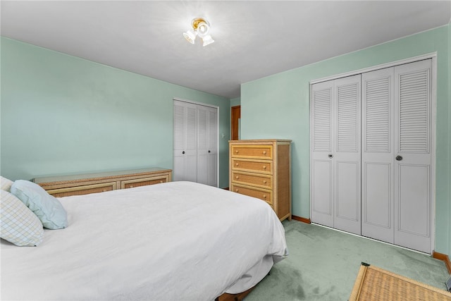 2228 Walton Ave, Overbrook, PA 15210 - bedroom with light colored carpet, two closets, and baseboards