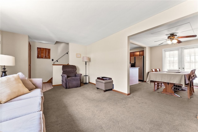 2228 Walton Ave, Overbrook, PA 15210 - living area with light colored carpet, ceiling fan, baseboards, and stairs