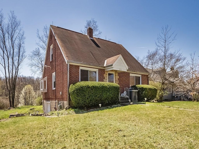 170 Millerstown Culmerville Rd, West Deer, PA 15084 - view of front of property with brick siding, a chimney, a front yard, and roof with shingles