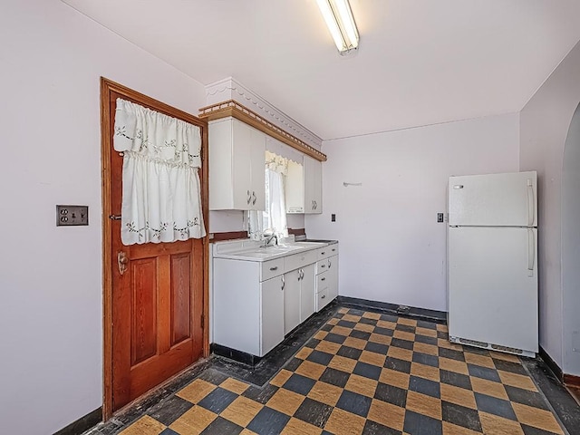 170 Millerstown Culmerville Rd, West Deer, PA 15084 - kitchen featuring freestanding refrigerator, white cabinets, baseboards, and light countertops