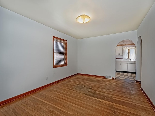 170 Millerstown Culmerville Rd, West Deer, PA 15084 - spare room with arched walkways, light wood finished floors, and baseboards