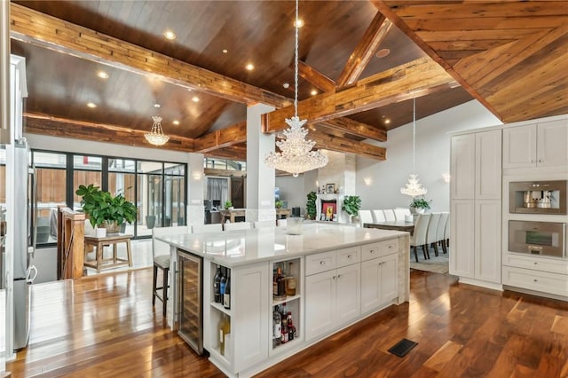kitchen with beverage cooler, open shelves, dark wood-style floors, a chandelier, and wood ceiling