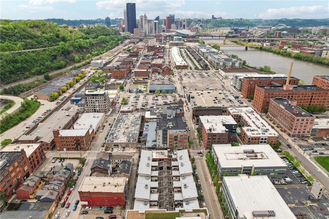 view of urban area with a notable bridge and a nearby body of water