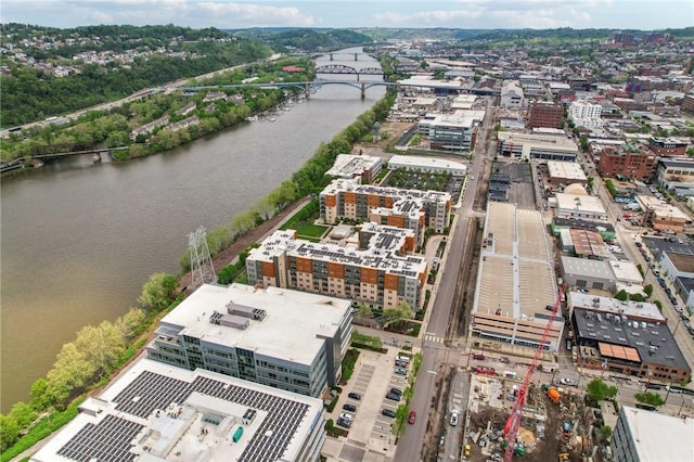 view of urban area featuring a notable bridge and a large body of water