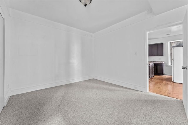 empty room featuring baseboards