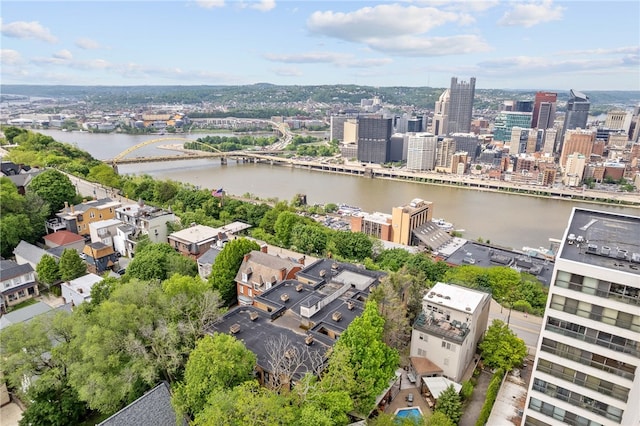 view of urban area featuring a notable bridge and a nearby body of water