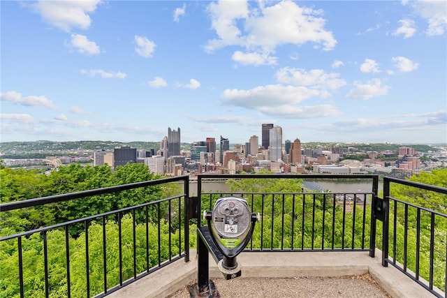 balcony featuring a skyline view