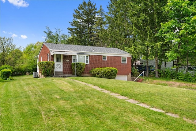 9235 Mary Ave, Mccandless, PA 15237 - ranch-style house with a front lawn, brick siding, and central AC unit