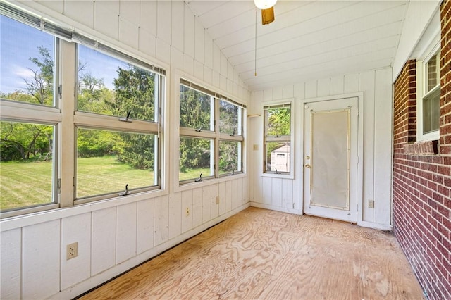 9235 Mary Ave, Mccandless, PA 15237 - unfurnished sunroom with lofted ceiling, wood finished floors, and wood walls