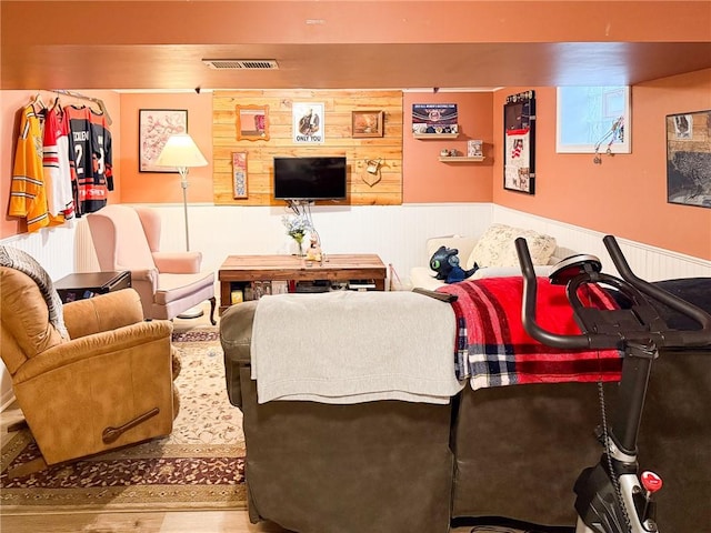 829 Cottonwood Dr, Monroeville, PA 15146 - living room with wainscoting, wood finished floors, and wood walls