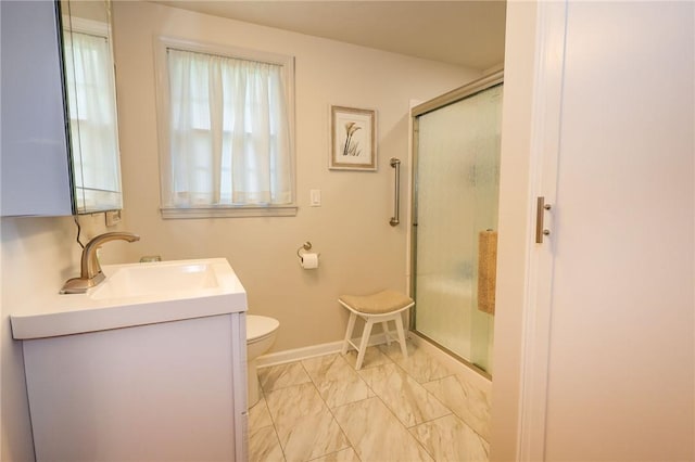 full bathroom with marble look tile flooring, a shower stall, vanity, toilet, and baseboards