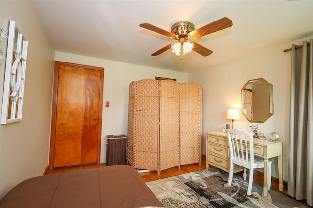 bedroom featuring wood finished floors and a ceiling fan