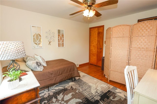 bedroom with wood finished floors and a ceiling fan