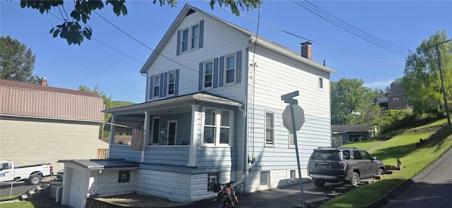 view of side of property featuring a chimney
