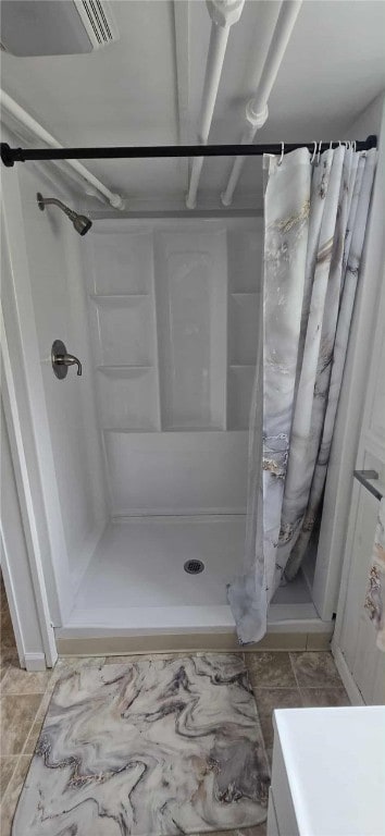 full bathroom with a stall shower