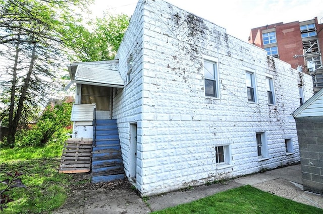 view of property exterior featuring stairs