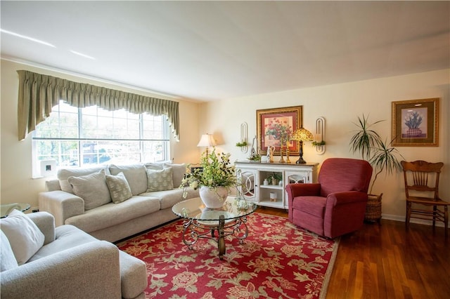 living area featuring wood finished floors and baseboards