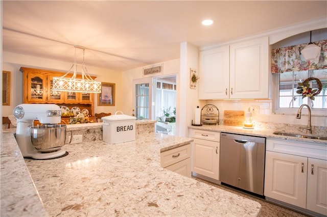 kitchen featuring dishwasher, a sink, white cabinets, light stone counters, and recessed lighting